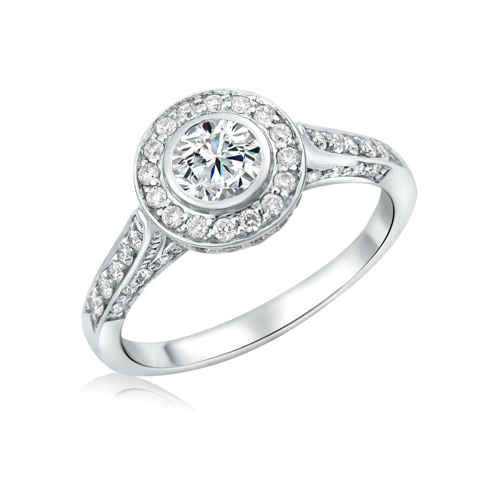 L’Orée Bezel Set Round Cut Engagement Ring With Halo And Three Row Pavé Band