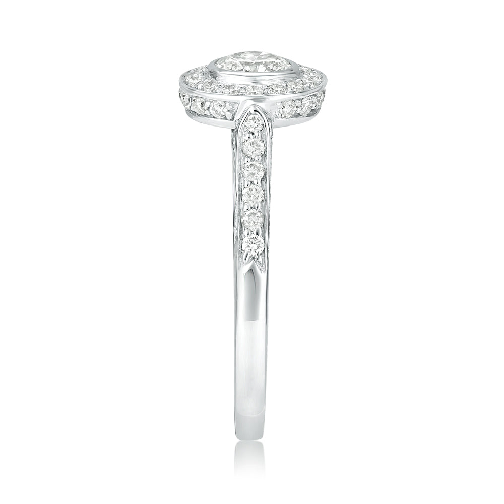 L’Orée Bezel Set Round Cut Engagement Ring With Halo And Three Row Pavé Band